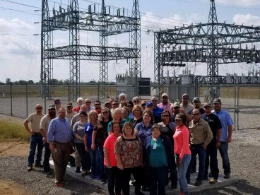 Photo showing an energy substation and SEMO Electric Cooperative employees.